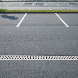 Large parking lot with white asphalt parking lines.
